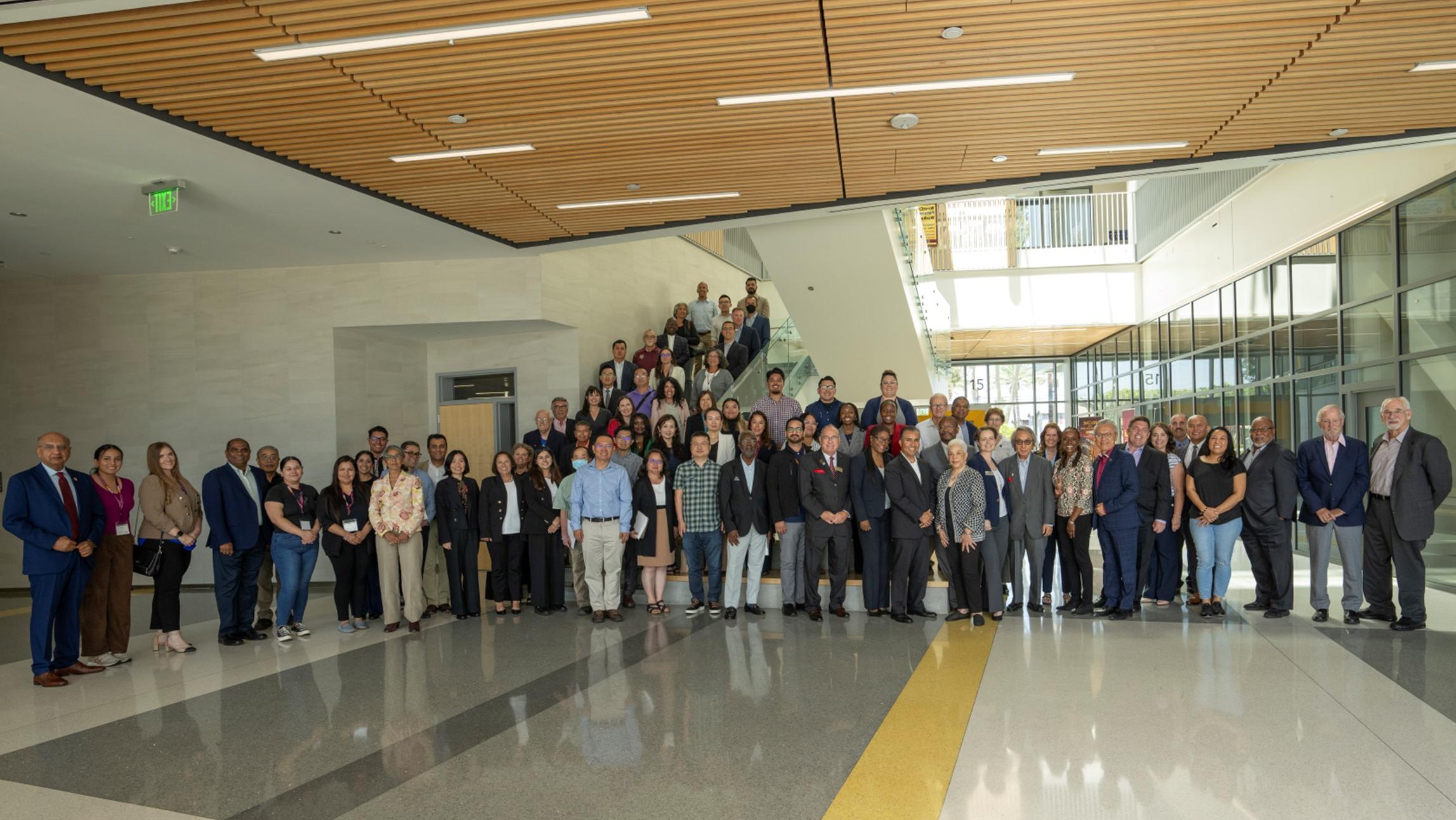 Faculty and Staff standing next to each other